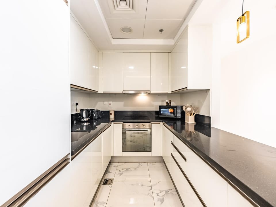 Kitchen or kitchenette, dishwasher, oven, stove, toaster