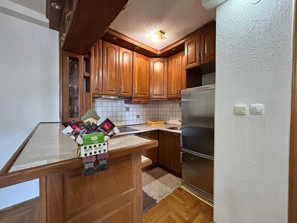 Kitchen or kitchenette, dishwasher, oven, stove