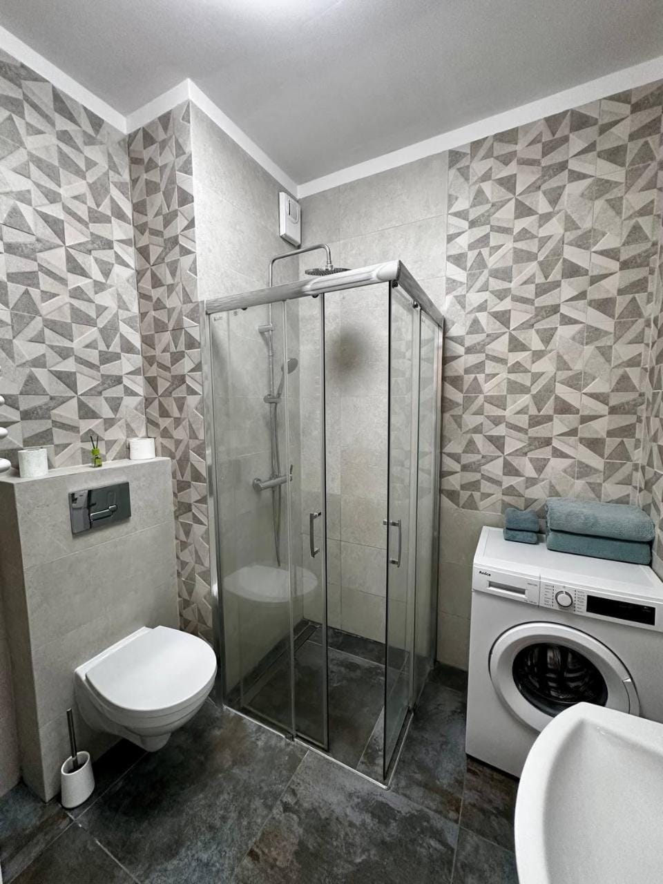 Shower, Toilet, Bathroom, towels, washing machine, dryer