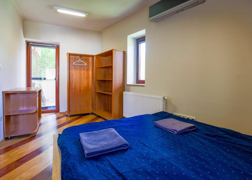 Bed, towels, wardrobe, air conditioner