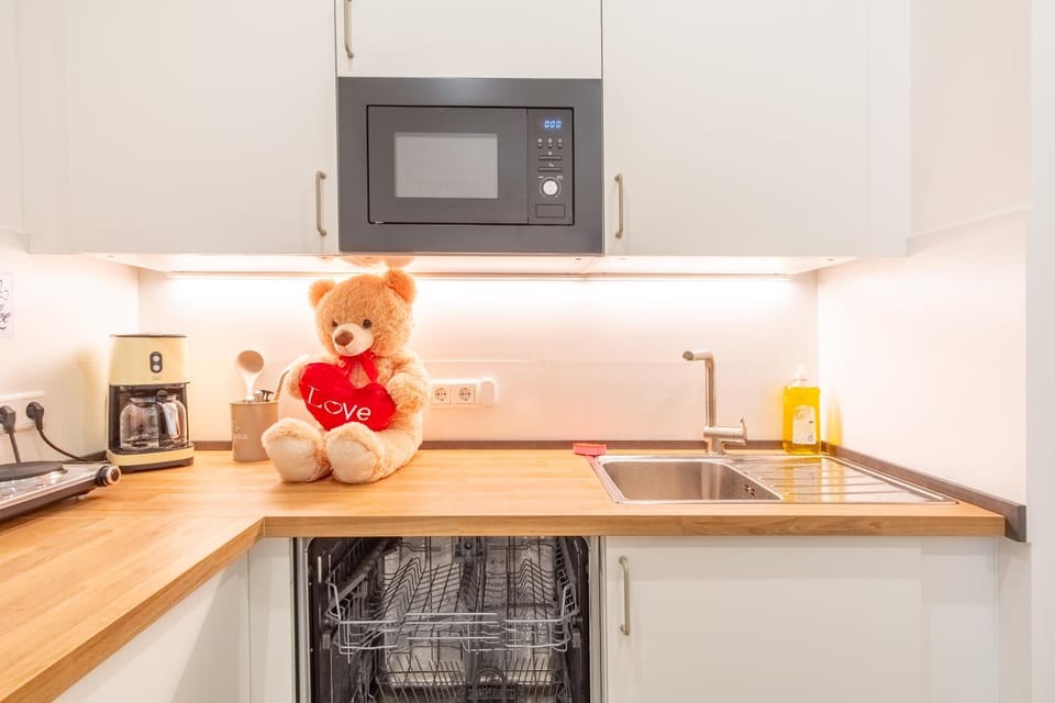 Kitchen or kitchenette, dishwasher, microwave, stove