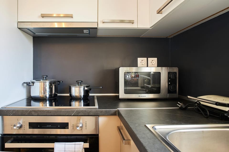 Kitchen or kitchenette, microwave, oven, stove, toaster