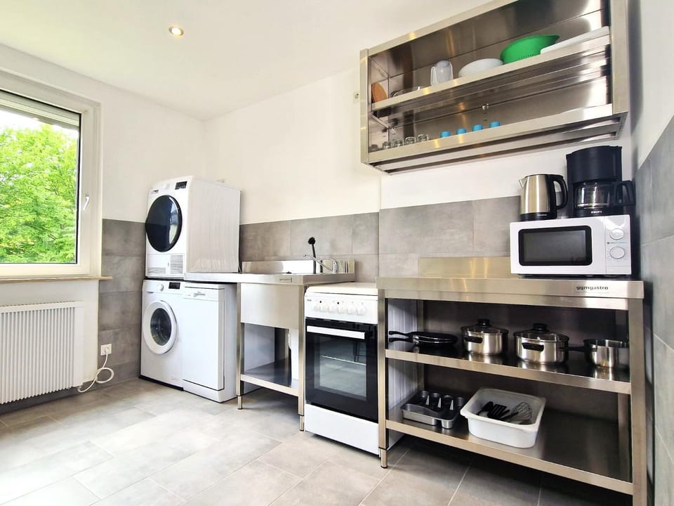 Kitchen or kitchenette, dishwasher, oven, stove, washing machine