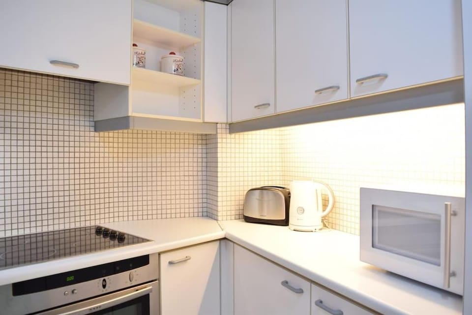 Kitchen or kitchenette, stove, toaster