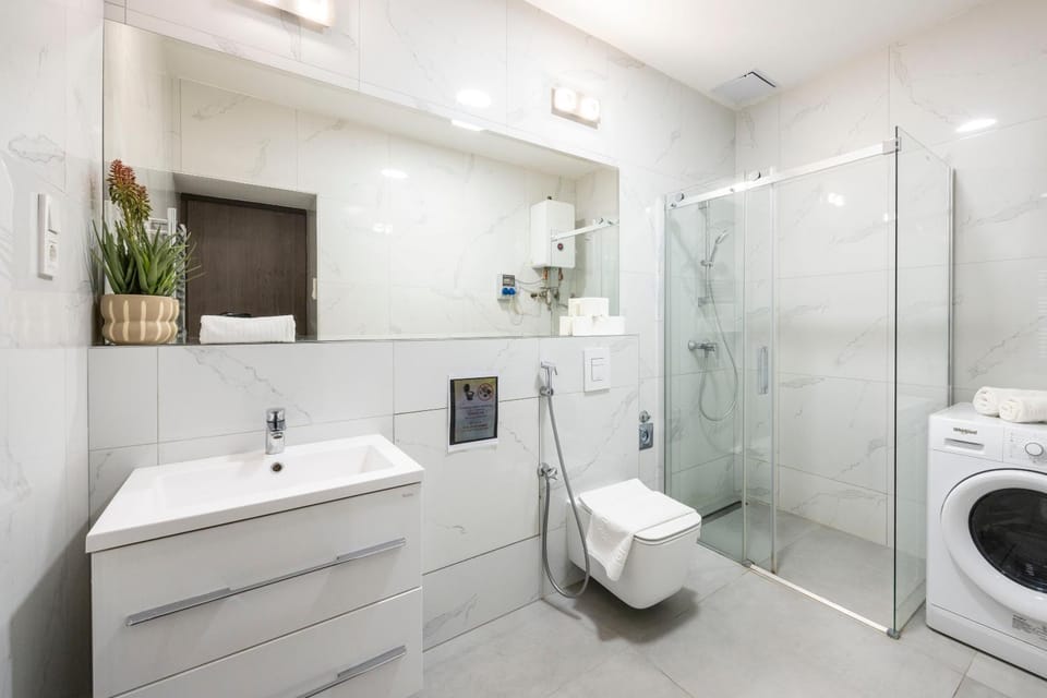 Shower, Toilet, Bathroom, bidet, towels, washing machine