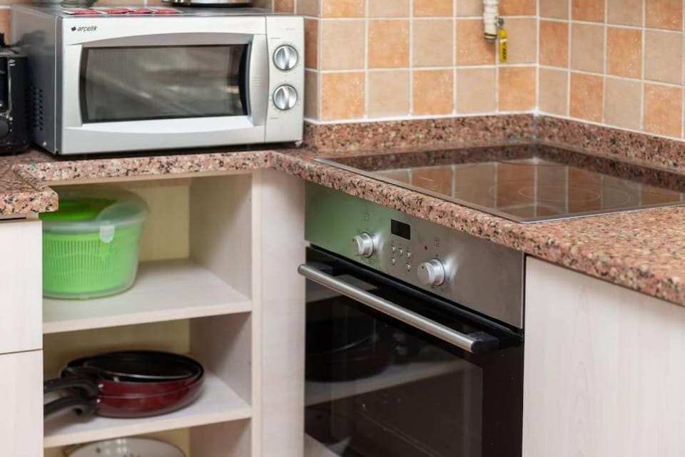 Kitchen or kitchenette, oven, stove, toaster
