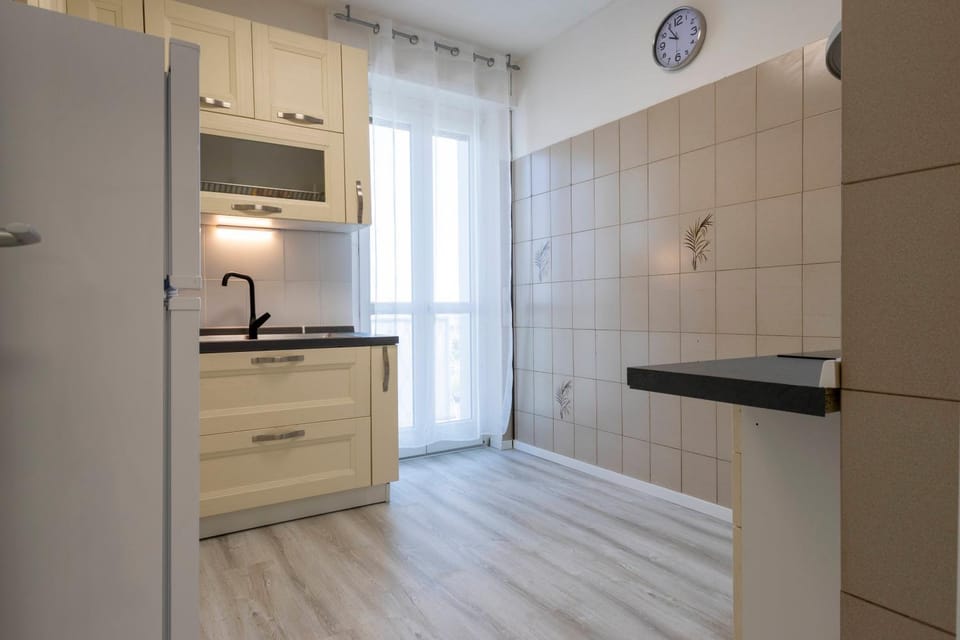 Kitchen or kitchenette, dishwasher, oven, stove