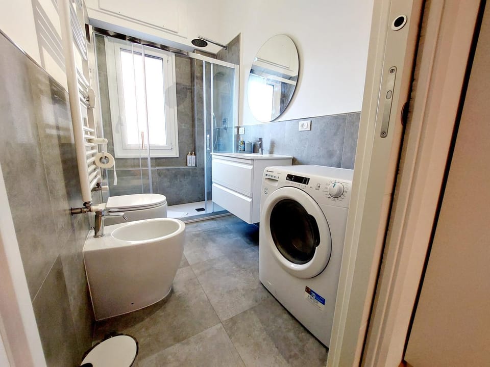 Shower, Toilet, Bathroom, towels, washing machine, dryer