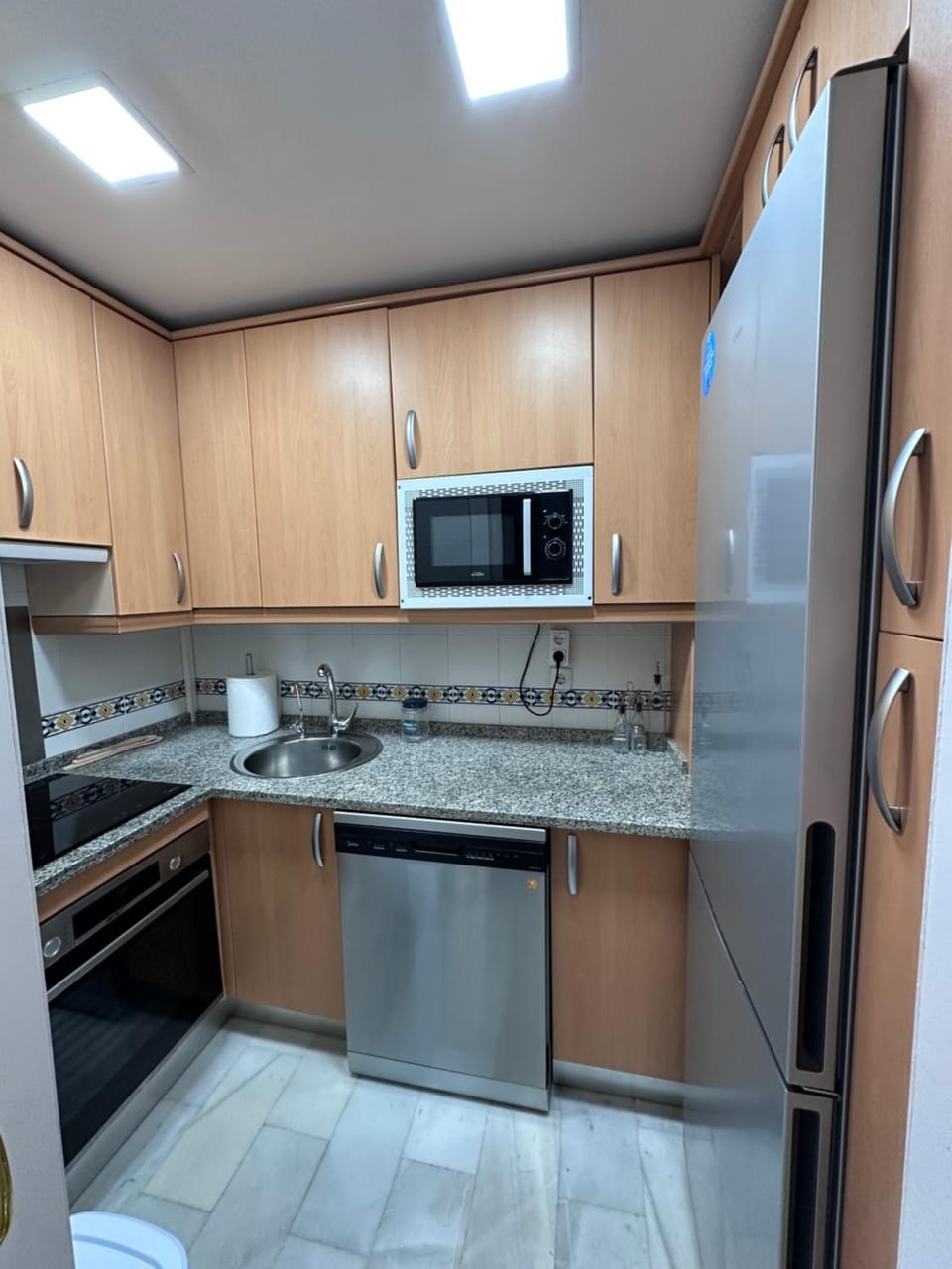 Kitchen or kitchenette, dishwasher, oven