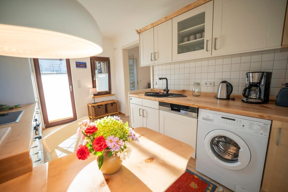 Kitchen or kitchenette, dishwasher, stove, toaster, washing machine