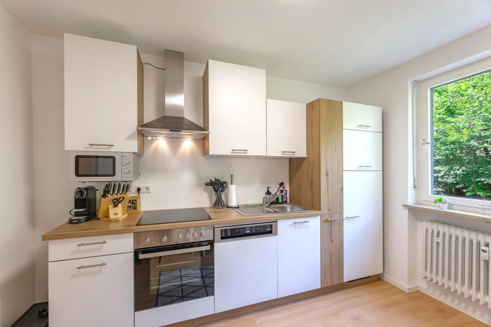 Kitchen or kitchenette, dishwasher, microwave, stove, toaster