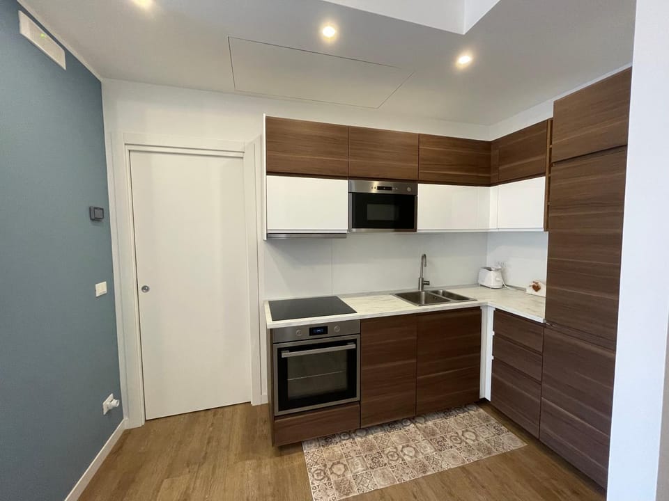 Kitchen or kitchenette, dishwasher, oven, stove, toaster