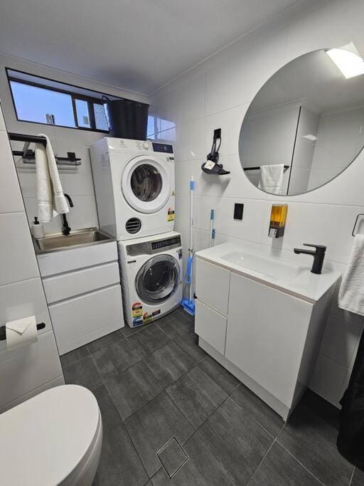 Shower, Toilet, Bathroom, hair dryier, towels, towels, washing machine, dryer