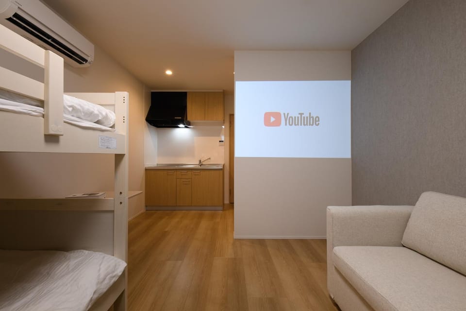 Bed, Living room, Seating area, Bedroom, air conditioner