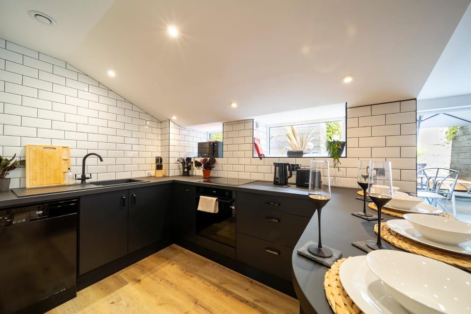 Kitchen or kitchenette, dishwasher, microwave, stove, toaster