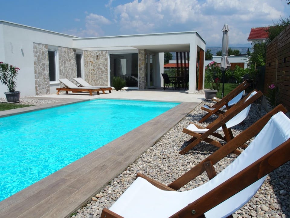 Property building, Swimming pool, Swimming pool, sunbed