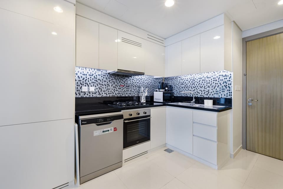 Kitchen or kitchenette, dishwasher, oven, stove
