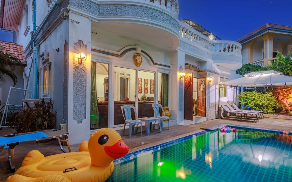 Property building, Patio, Night, Pool view, Swimming pool, sunbed