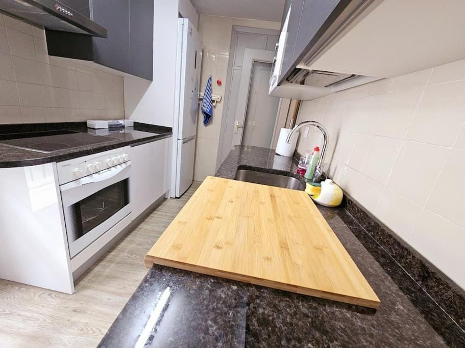 Kitchen or kitchenette, dishwasher, oven, stove, washing machine