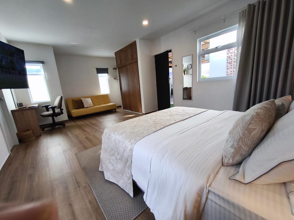 Bed, Seating area, wardrobe