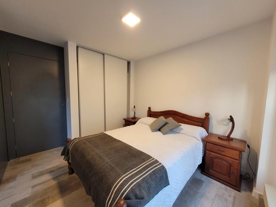 Bed, towels, wardrobe
