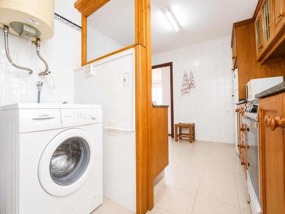 Kitchen or kitchenette, washing machine