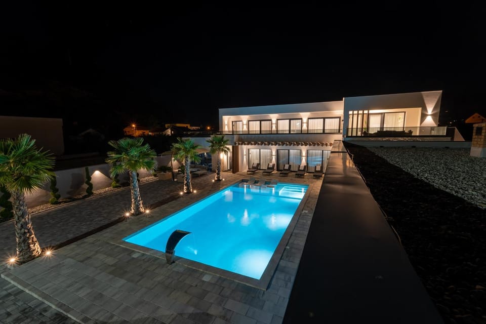Property building, Night, Pool view, Swimming pool, sunbed