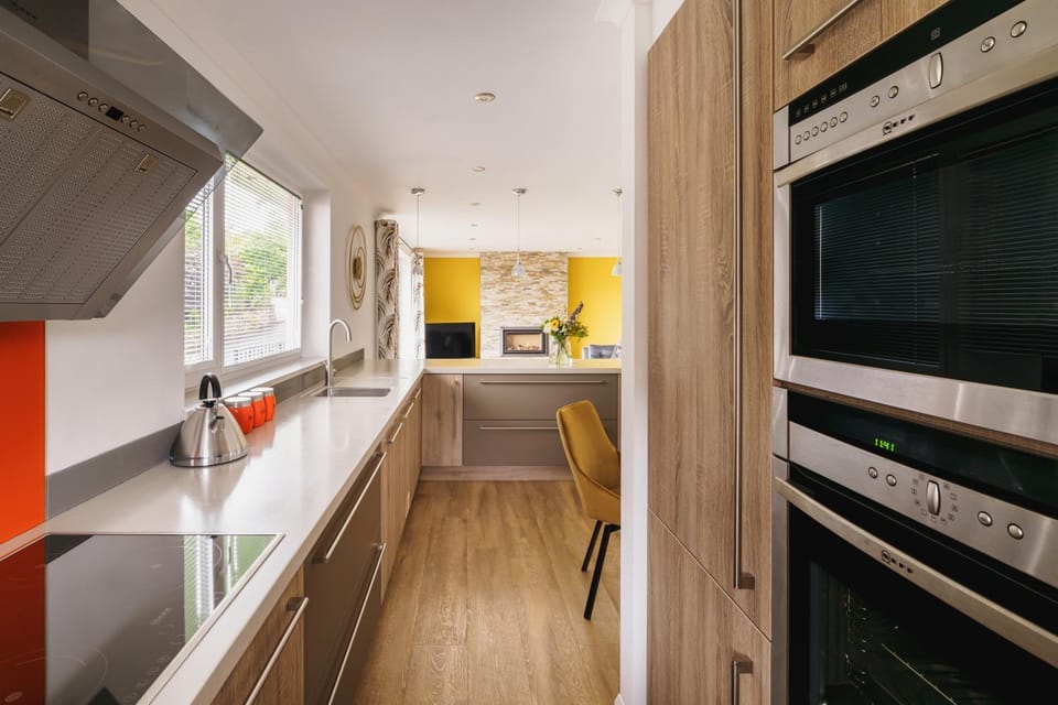 Kitchen or kitchenette, dishwasher, oven, stove