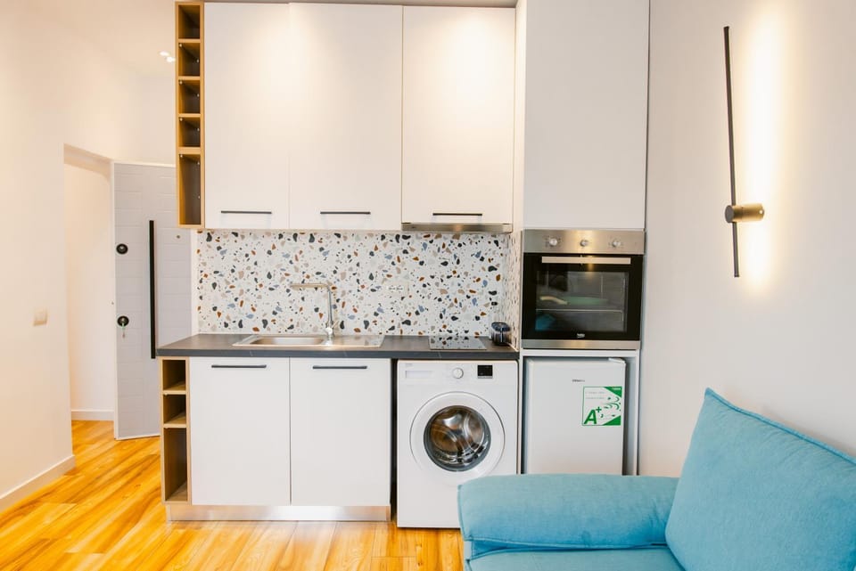 Kitchen or kitchenette, dishwasher, oven, stove, washing machine