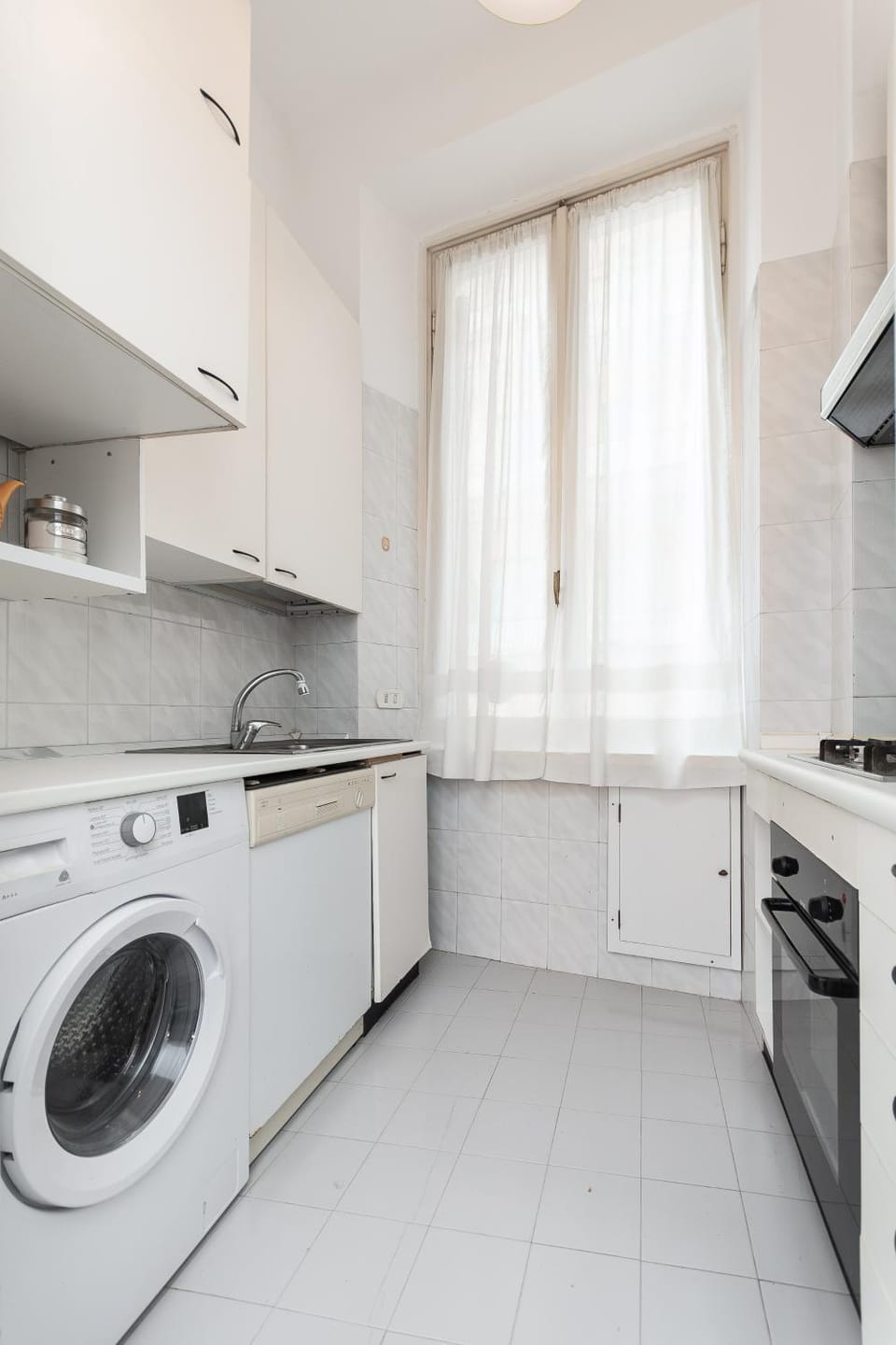 Kitchen or kitchenette, dishwasher, stove, washing machine