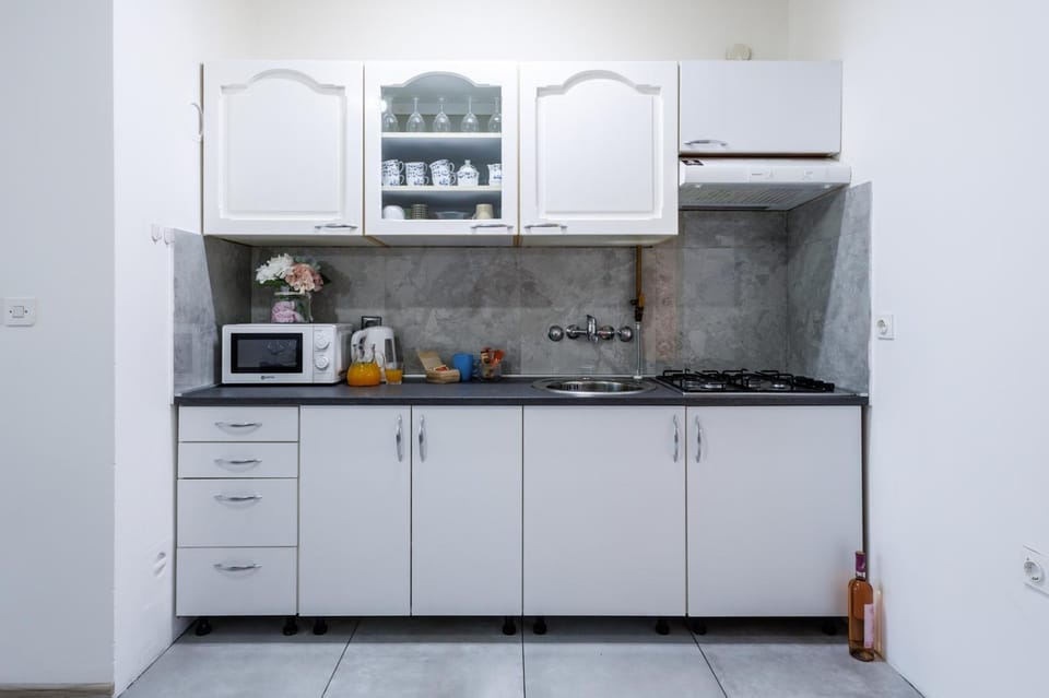 Kitchen or kitchenette, stove, toaster