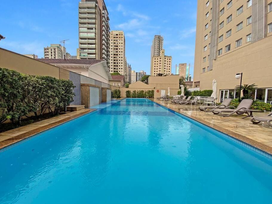 Property building, Day, Pool view, Swimming pool, sunbed