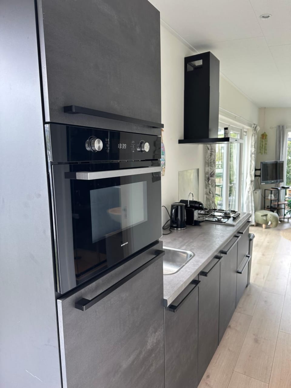 Kitchen or kitchenette, dishwasher, oven, stove