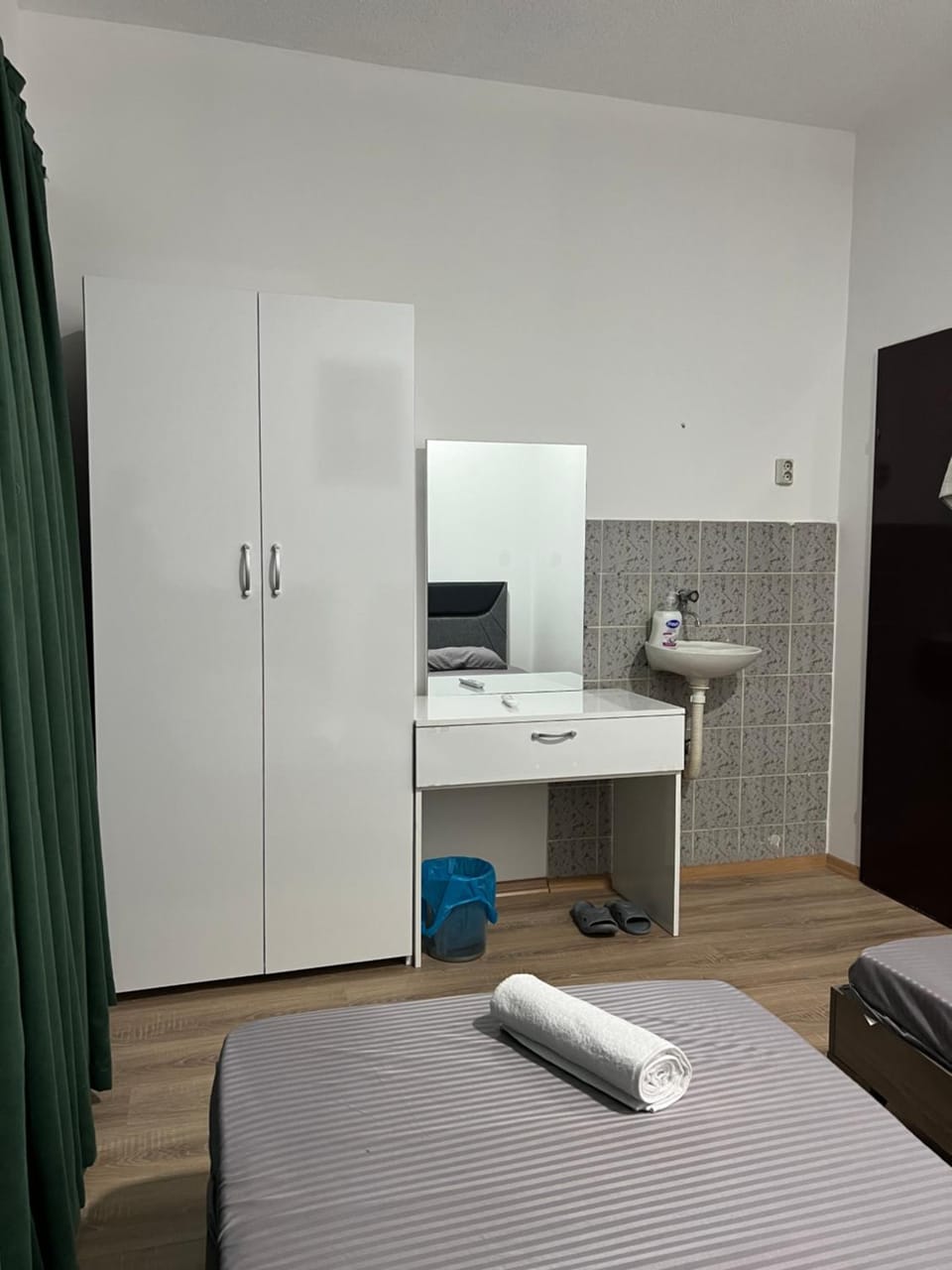 Bed, hair dresser, towels, wardrobe