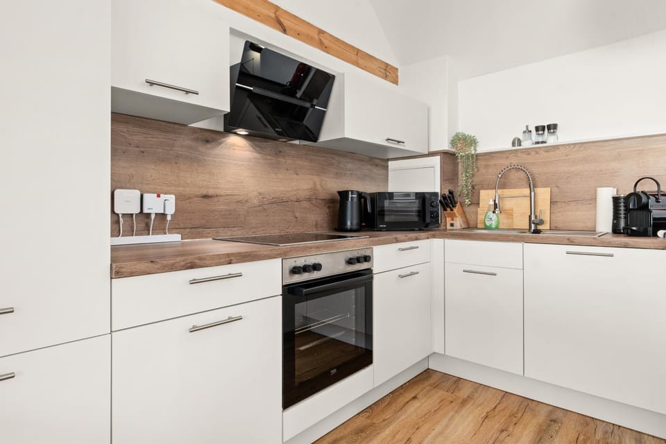 Kitchen or kitchenette, microwave, oven, stove, kitchen