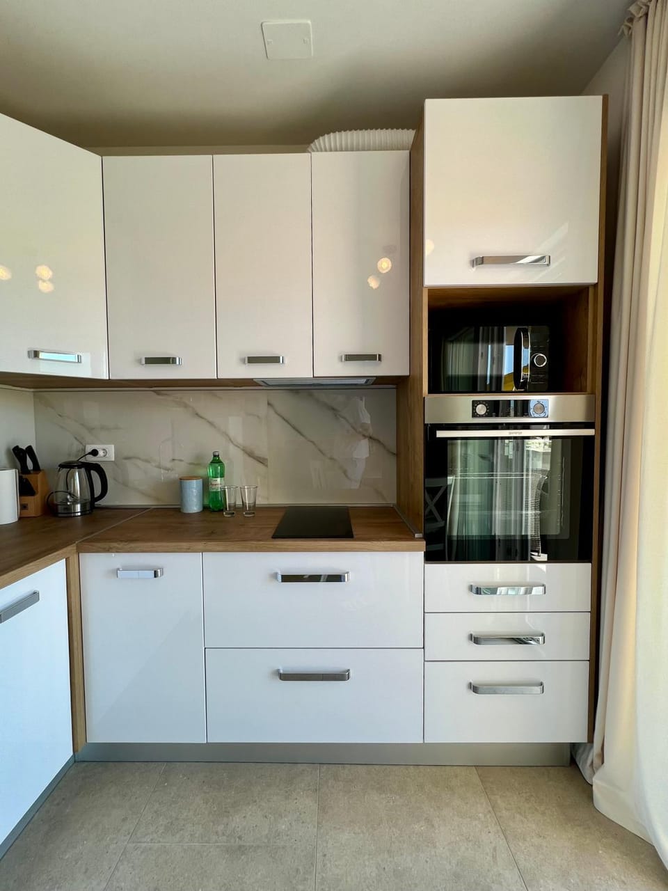 Kitchen or kitchenette, dishwasher, microwave, oven, stove