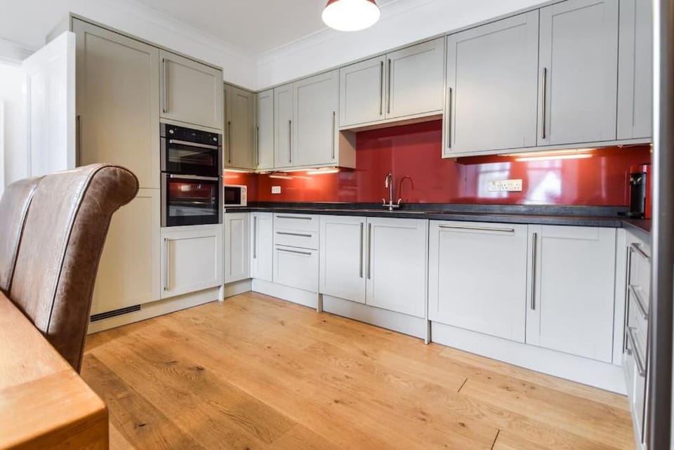 Kitchen or kitchenette, dishwasher, oven, stove