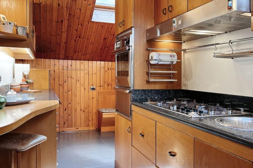 Kitchen or kitchenette, dishwasher, microwave, oven, stove