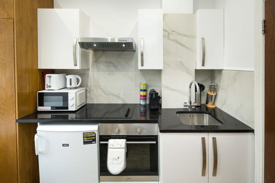 Kitchen or kitchenette, oven, stove, toaster
