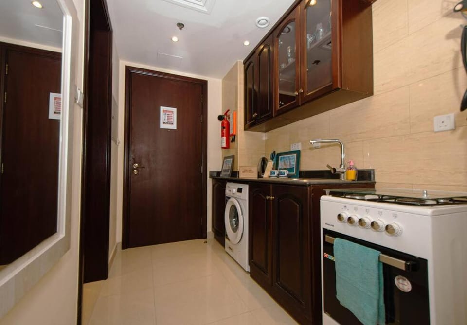 Kitchen or kitchenette, oven, stove, washing machine