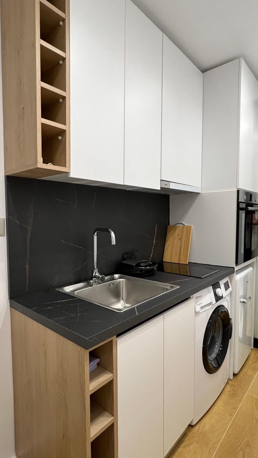 Kitchen or kitchenette, stove, washing machine