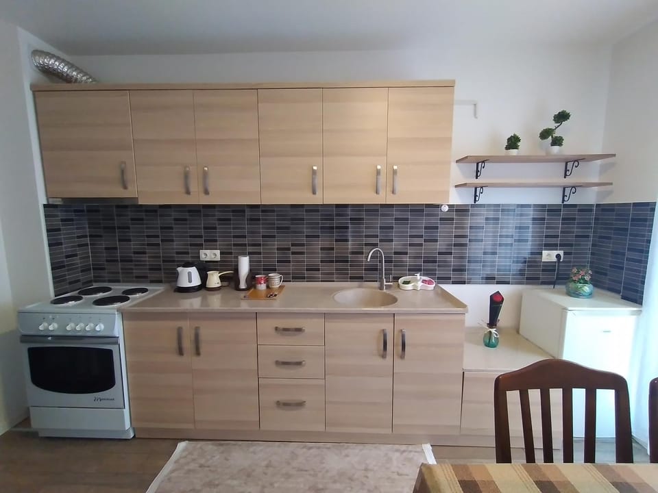 Kitchen or kitchenette, Dining area, oven, stove, washing machine, dryer