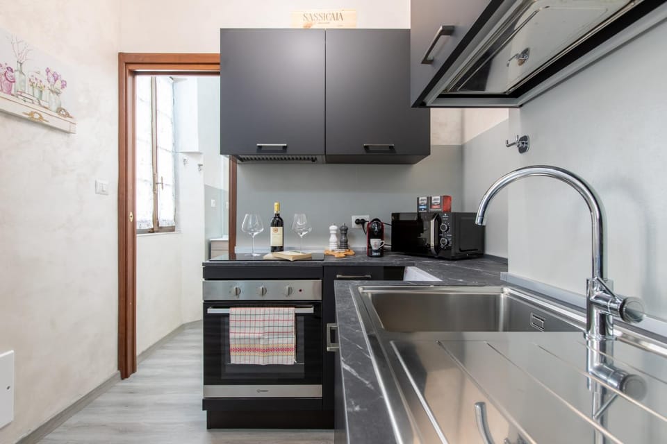 Kitchen or kitchenette, dishwasher, oven, stove