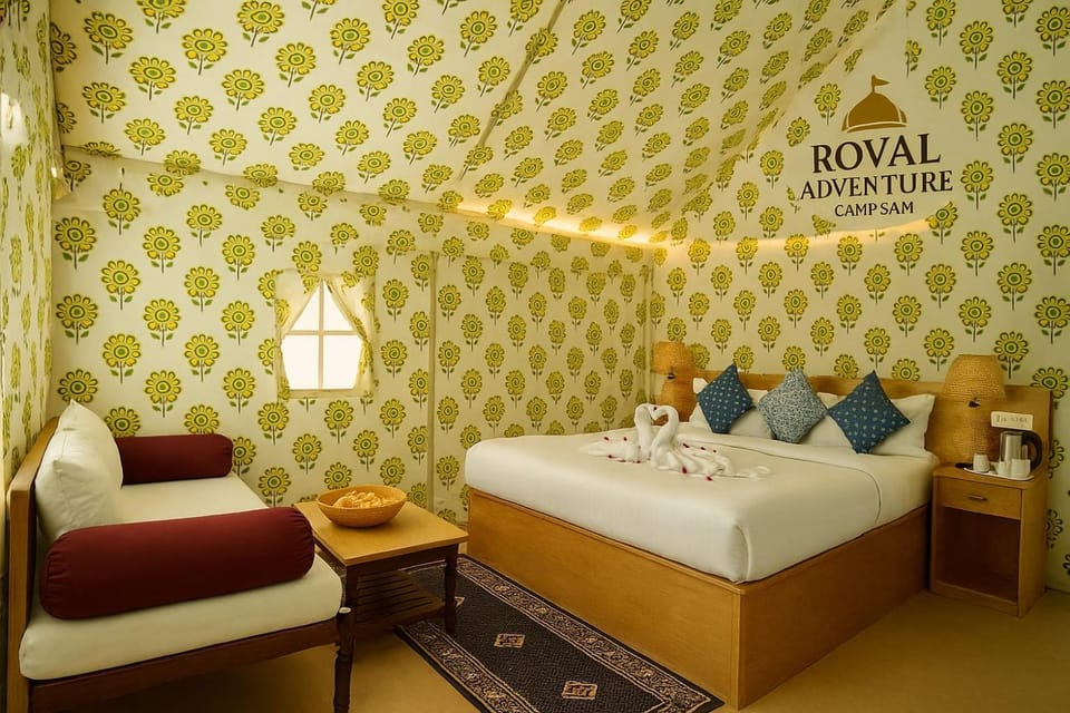 Bed, Photo of the whole room, Text overlay, towels