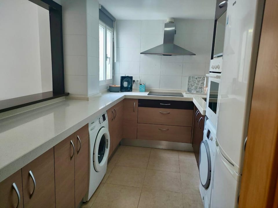 Kitchen or kitchenette, oven, stove, toaster, washing machine, dryer