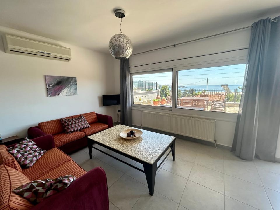 Living room, Seating area, Sea view, air conditioner