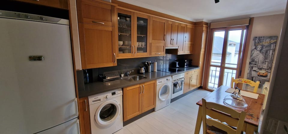 Kitchen or kitchenette, oven, stove, toaster, washing machine, dryer