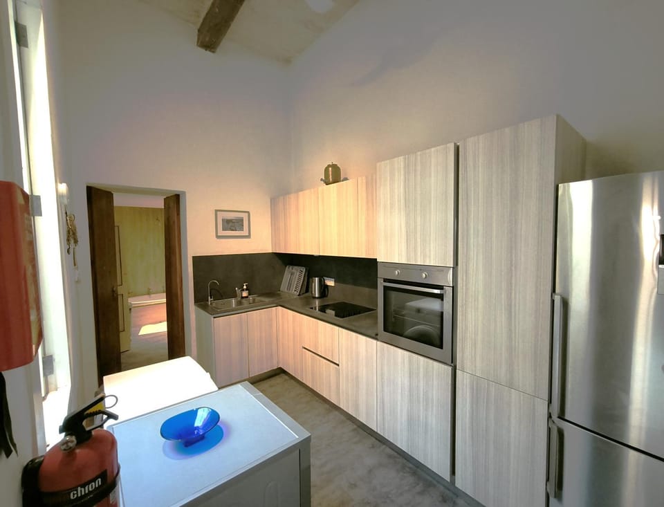 Kitchen or kitchenette, dishwasher, oven, stove