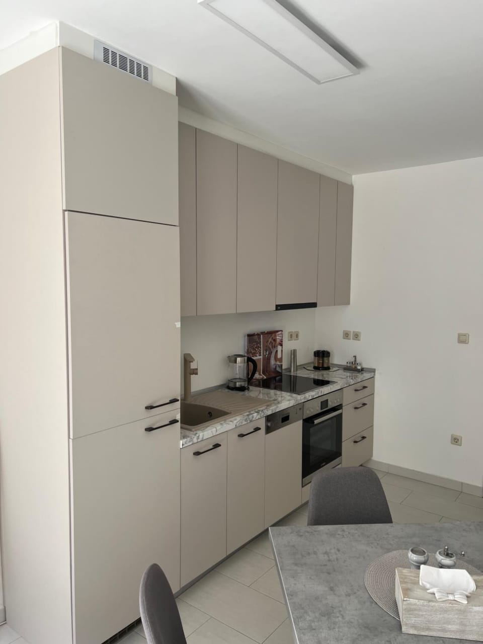 Kitchen or kitchenette, dishwasher, oven, stove