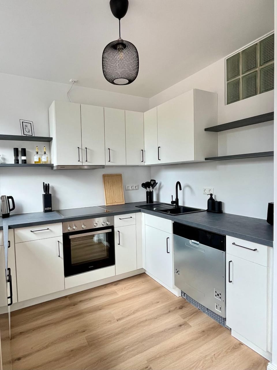 Kitchen or kitchenette, dishwasher, oven, stove, toaster